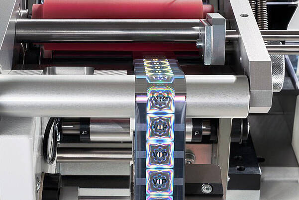Hot-embossed holograms for plastic injection molded parts Hologram application via KURZ hot-stamping machine